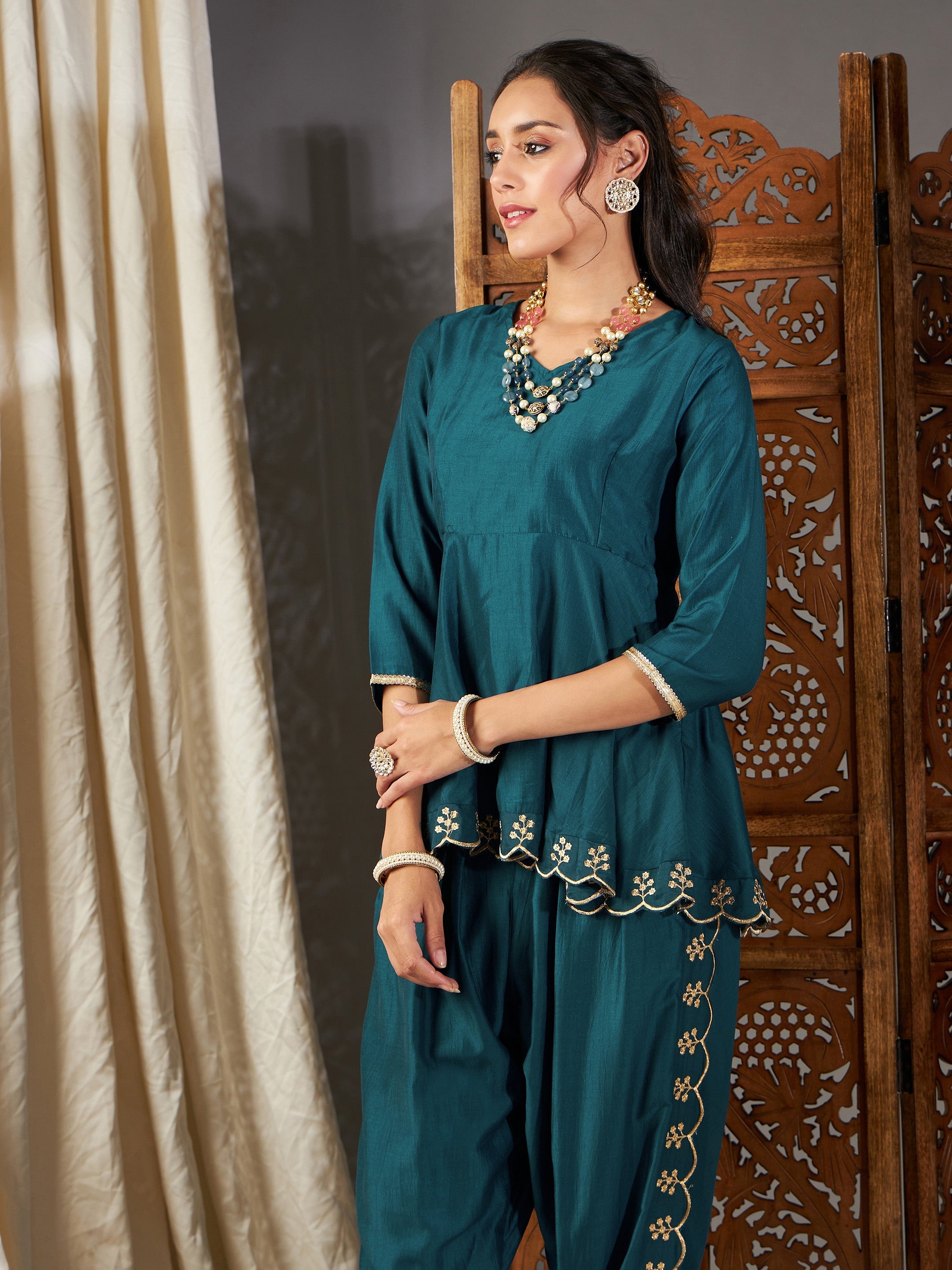 Women Teal Zari Embroidered Peplum Top